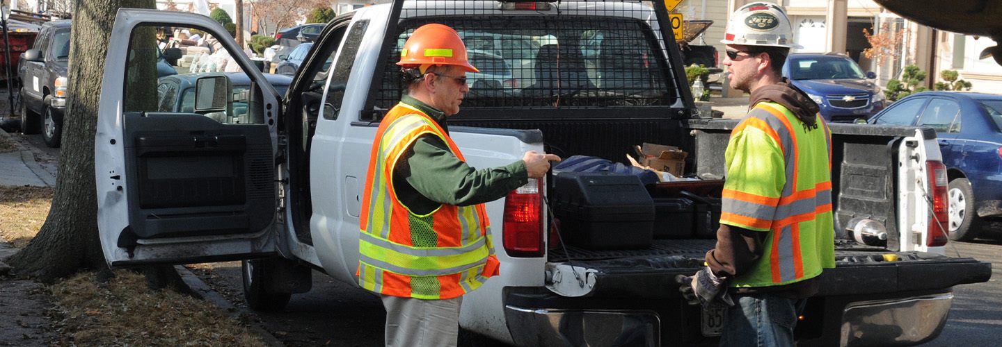 Department of Transportation inspectors monitoring debris removal 