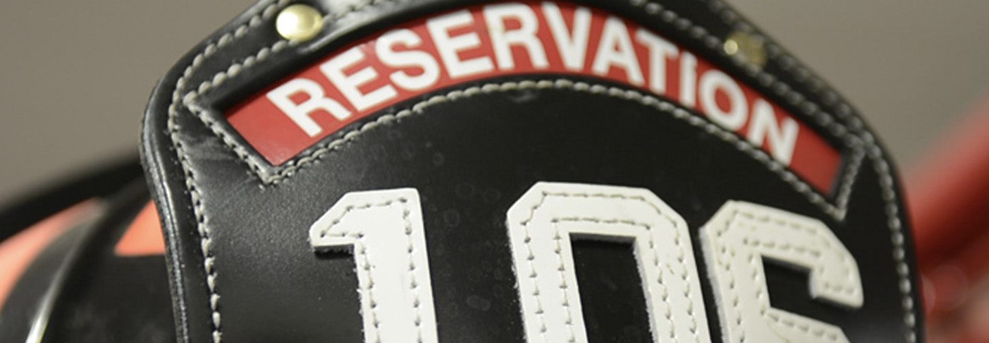 A firefighter's helmet that says "reservation" on the top