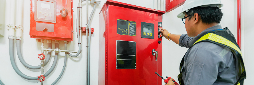 A worker inspects a fire unit A worker inspects a fire unit