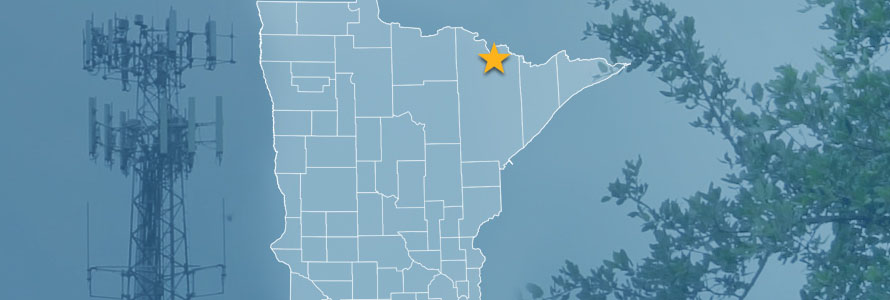 The state of Minnesota, with outlined county borders and a star locating the Kabetogama State Forest; a cell tower and tree The state of Minnesota, with outlined county borders and a star locating the Kabetogama State Forest; a cell tower and tree