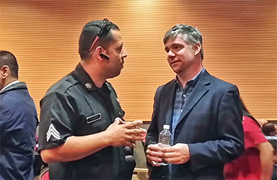 A member of the FirstNet Authority’s Public Safety Advocacy team speaks with an officer at one of the 500 engagements from across the nation. 