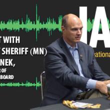 Harry Markley and Richard Stanek speak, sitting at a table
