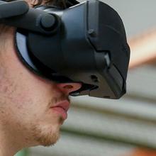 Man wearing a virtual reality headset in the Public Safety Immersive Test Center