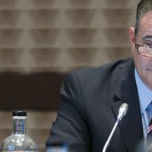 Chief Richard Carrizzo speaks into a microphone at a FirstNet Authority Board meeting