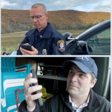 Public works official works on down electric wires near tree; police officer stands next to law enforcement vehicle and looks at mobile phone with large forested hill in background; firefighter in uniform holds tablet in front of fire engine; telecommunicator wearing headset sits at desk with multiple computer screens; public safety official holds up smartphone; emergency management services official looks at mobile device in back of ambulance with patient and equipment